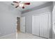 Bright bedroom featuring tile floors, neutral paint, and a closet at 28707 Raleigh Pl, Wesley Chapel, FL 33545