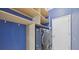 Bright laundry room featuring an LG washer and dryer and custom shelving at 28707 Raleigh Pl, Wesley Chapel, FL 33545