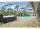 Enclosed pool area with a slide and hot tub perfect for outdoor fun and relaxation at 28707 Raleigh Pl, Wesley Chapel, FL 33545