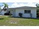 Charming single-story home with a well-maintained lawn and tropical landscaping at 9093 108Th St, Seminole, FL 33772
