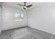 A bedroom is shown with a window view and a ceiling fan at 4358 Murdock Ave, Sarasota, FL 34231