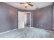 This bedroom has soft carpeting and a ceiling fan, and is painted in a neutral color at 4358 Murdock Ave, Sarasota, FL 34231