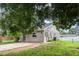 Cozy single-story home with a fresh gray paint job, new roof, and a tidy yard framed by mature trees at 4358 Murdock Ave, Sarasota, FL 34231