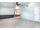 Inviting living room features plush carpeting, a modern ceiling fan, and a fresh two-tone paint scheme at 4358 Murdock Ave, Sarasota, FL 34231