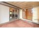 Enclosed porch provides extra living space with an open view into the dining room through sliding glass doors at 4358 Murdock Ave, Sarasota, FL 34231