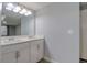 Bathroom features a double sink vanity and a large mirror at 9516 Woodborough Ct, Tampa, FL 33615
