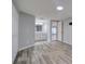 Bedroom with laminate flooring leads to the en-suite bathroom at 9516 Woodborough Ct, Tampa, FL 33615
