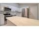 Modern kitchen with stainless steel appliances and quartz countertops at 9516 Woodborough Ct, Tampa, FL 33615