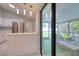 Bright kitchen with stainless steel appliances and access to the patio at 9516 Woodborough Ct, Tampa, FL 33615