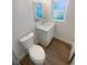 Bathroom with modern vanity, sink, and toilet at 5511 Drinkard Dr, New Port Richey, FL 34653
