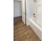 Updated bathroom featuring a new bathtub, and tiled shower at 5511 Drinkard Dr, New Port Richey, FL 34653