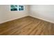Clean and bright bedroom with hardwood floors at 5511 Drinkard Dr, New Port Richey, FL 34653