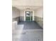 A covered front porch with a stone facade features a green front door at 5511 Drinkard Dr, New Port Richey, FL 34653