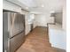 Modern kitchen featuring stainless steel appliances, white cabinetry, and marble countertops at 5511 Drinkard Dr, New Port Richey, FL 34653