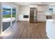 Remodeled kitchen with stainless steel appliances, white cabinets and great views of the backyard and lake at 5511 Drinkard Dr, New Port Richey, FL 34653