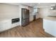 Bright, remodeled kitchen with stainless steel appliances, and white cabinets at 5511 Drinkard Dr, New Port Richey, FL 34653