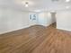 Bright living room with wood floors, neutral walls and white trim exudes a modern aesthetic at 5511 Drinkard Dr, New Port Richey, FL 34653