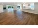 Bright open floor plan features hardwood floors and a gas fireplace and a lake view at 5511 Drinkard Dr, New Port Richey, FL 34653
