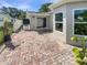 A brick patio with white vinyl fencing surrounds the perimeter at 5511 Drinkard Dr, New Port Richey, FL 34653