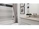 Modern bathroom showcasing sleek tile accents and a stylish vanity with contemporary fixtures at 14375 Hammock Oak St, Parrish, FL 34219
