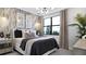 Comfortable bedroom featuring patterned wallpaper and decor with ample natural light at 14375 Hammock Oak St, Parrish, FL 34219