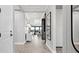Bright hallway featuring modern decor and natural light, leading to an open living area at 14375 Hammock Oak St, Parrish, FL 34219