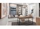 Chic home office with a built-in bench seat, desk, and decorative artwork at 14375 Hammock Oak St, Parrish, FL 34219