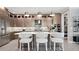 Contemporary kitchen with modern appliances, stylish pendant lights, an island with seating, and sleek cabinetry at 14375 Hammock Oak St, Parrish, FL 34219