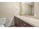Standard bathroom showcasing a vanity, sink, mirror, and commode with tile flooring at 2002 Culpepper Dr, Brandon, FL 33511