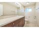 Bright bathroom features a neutral color scheme and combined tub and shower at 2002 Culpepper Dr, Brandon, FL 33511