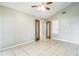 Bedroom with tile floors, vaulted ceiling, a ceiling fan, and a glass paned french door at 2002 Culpepper Dr, Brandon, FL 33511