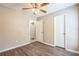 Bedroom featuring wood-look flooring, a ceiling fan, and trim work at 2002 Culpepper Dr, Brandon, FL 33511