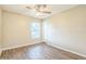 Bedroom featuring sleek, modern wood flooring and a bright window at 2002 Culpepper Dr, Brandon, FL 33511