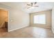 Bedroom with tile flooring features one window and an adjoining bathroom with vanity and sink at 2002 Culpepper Dr, Brandon, FL 33511