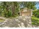 Charming home featuring a two-car garage, neutral color scheme, and mature trees providing ample shade at 2002 Culpepper Dr, Brandon, FL 33511