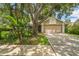 Charming home featuring a two-car garage, neutral color scheme, and mature trees providing ample shade at 2002 Culpepper Dr, Brandon, FL 33511