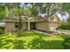 Traditional home with a well-maintained lawn and a two-car garage, perfect for comfortable suburban living at 2002 Culpepper Dr, Brandon, FL 33511