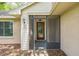 Inviting front entrance with a screened-in porch and a decorative glass front door for a touch of elegance at 2002 Culpepper Dr, Brandon, FL 33511
