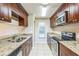 The well-equipped kitchen features granite counters, stainless appliances, and ample cabinet space at 2002 Culpepper Dr, Brandon, FL 33511