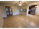 An open-concept living room features tile floors and seamless flow to the kitchen with stainless steel appliances at 2002 Culpepper Dr, Brandon, FL 33511