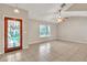 A bright living room welcomes you with a decorative glass door and a cozy atmosphere with tile flooring at 2002 Culpepper Dr, Brandon, FL 33511