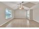 A sunlit living room with tile flooring offers a serene atmosphere with views from multiple windows at 2002 Culpepper Dr, Brandon, FL 33511
