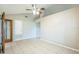 Bright living room with vaulted ceilings, tile floors, and fan at 2002 Culpepper Dr, Brandon, FL 33511