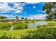 Scenic pond view surrounded by manicured lawns and mature trees, creating a peaceful and picturesque setting at 2002 Culpepper Dr, Brandon, FL 33511