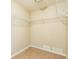 Spacious walk-in closet offering ample shelving and tile floors at 2002 Culpepper Dr, Brandon, FL 33511