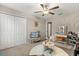 Cozy bedroom with a shag rug, closet, vanity and a ceiling fan, great for relaxation and personal space at 4704 Wild Senna Blvd, Tampa, FL 33619