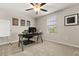 Well-lit bedroom featuring a desk, large window offering natural light, and motivational artwork at 4704 Wild Senna Blvd, Tampa, FL 33619