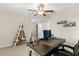 Inviting bedroom with a large desk, contemporary decor, and natural light for a comfortable workspace at 4704 Wild Senna Blvd, Tampa, FL 33619