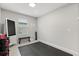 A simple gym room features a bench, fan, and workout equipment at 4704 Wild Senna Blvd, Tampa, FL 33619