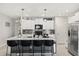 A modern kitchen boasting an island with bar seating, stainless steel appliances, and sleek countertops at 4704 Wild Senna Blvd, Tampa, FL 33619